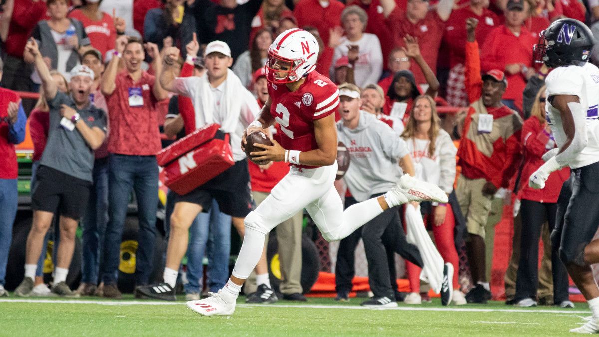 25-yd TD run Adrian Martinez