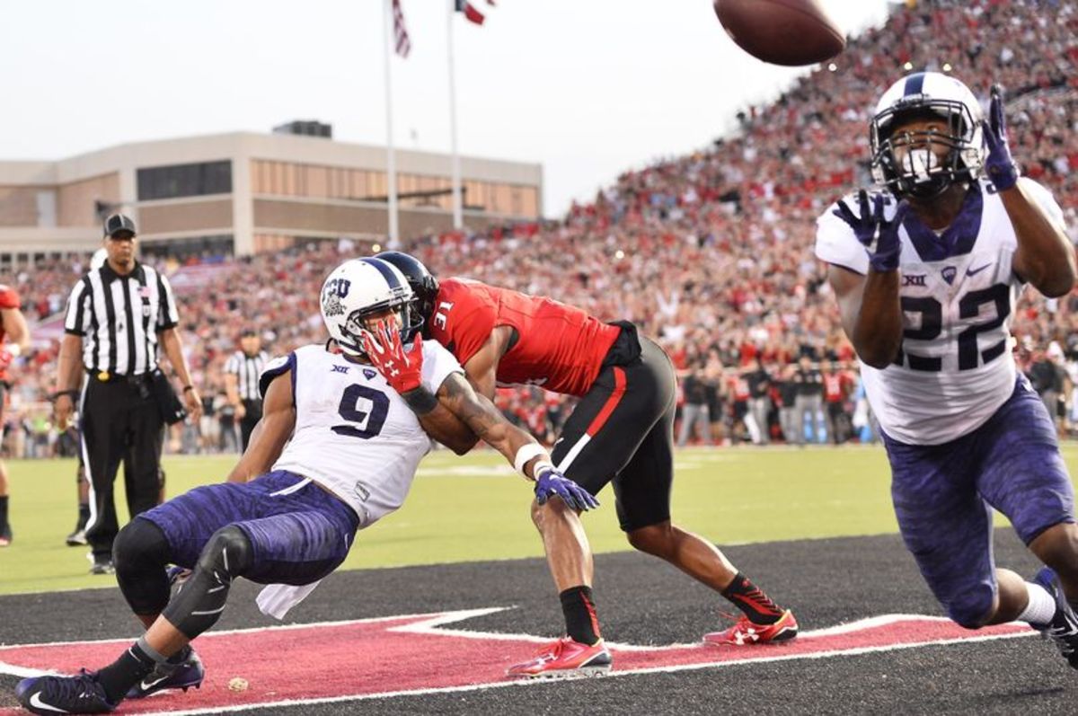 TCU tailback Aaron Green, right, catches the winning touchdown with 23 seconds left against Texas Tech after a deflection on September 26, 2015.
