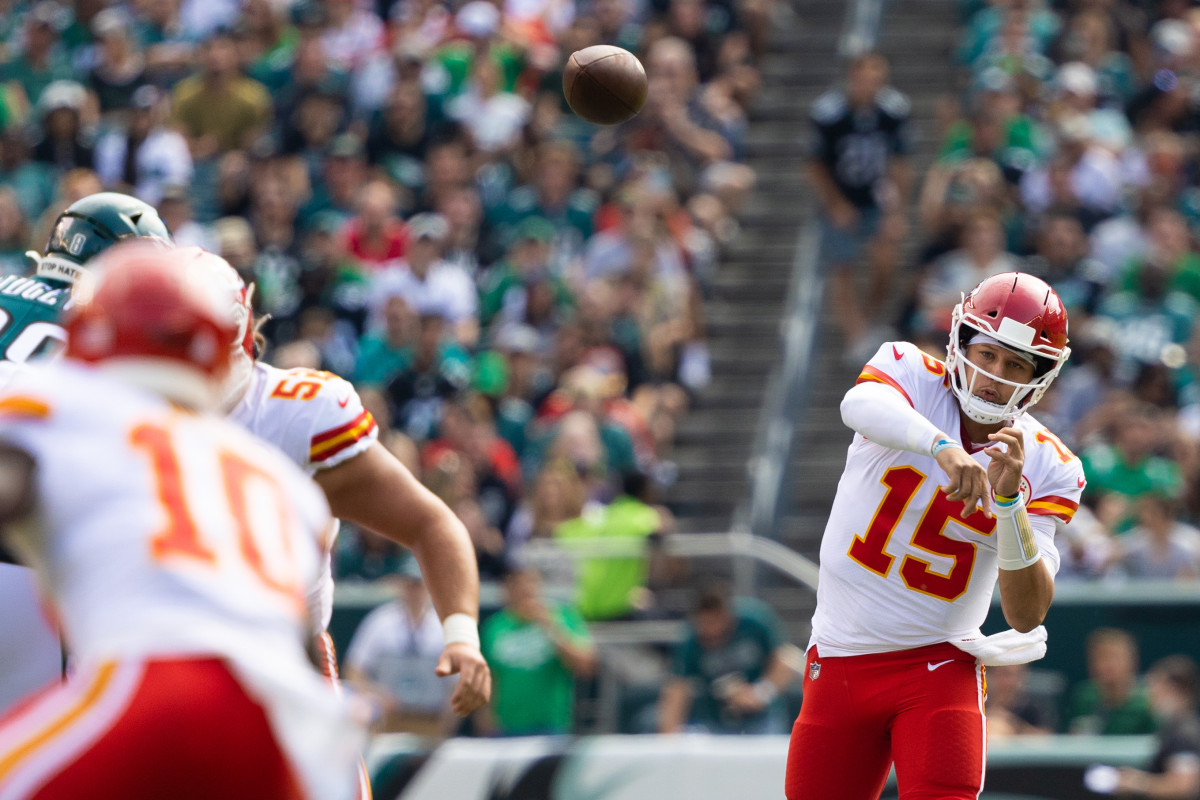 Oct 3, 2021; Philadelphia, Pennsylvania, USA; Kansas City Chiefs quarterback Patrick Mahomes (15) passes the ball to wide receiver Tyreek Hill (10) during the first quarter against the Philadelphia Eagles at Lincoln Financial Field. Mandatory Credit: Bill Streicher-USA TODAY Sports