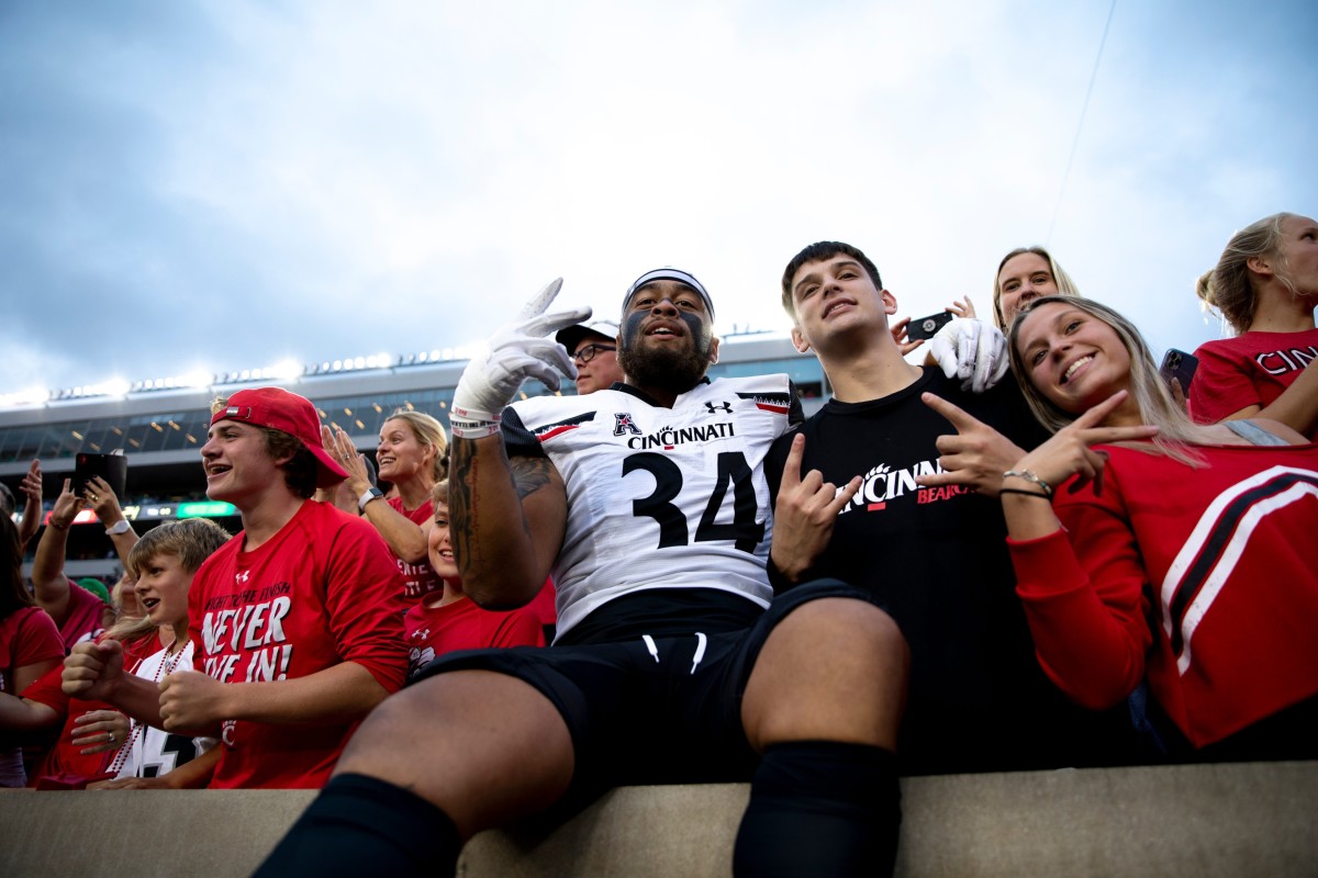 Cincinnati Bearcats defensive lineman Justin Wodtly (34) smiles with fans after the NCAA football game on Saturday, Oct. 2, 2021, at Notre Dame Stadium in South Bend, Ind. Cincinnati Bearcats defeated Notre Dame Fighting Irish 24-13.