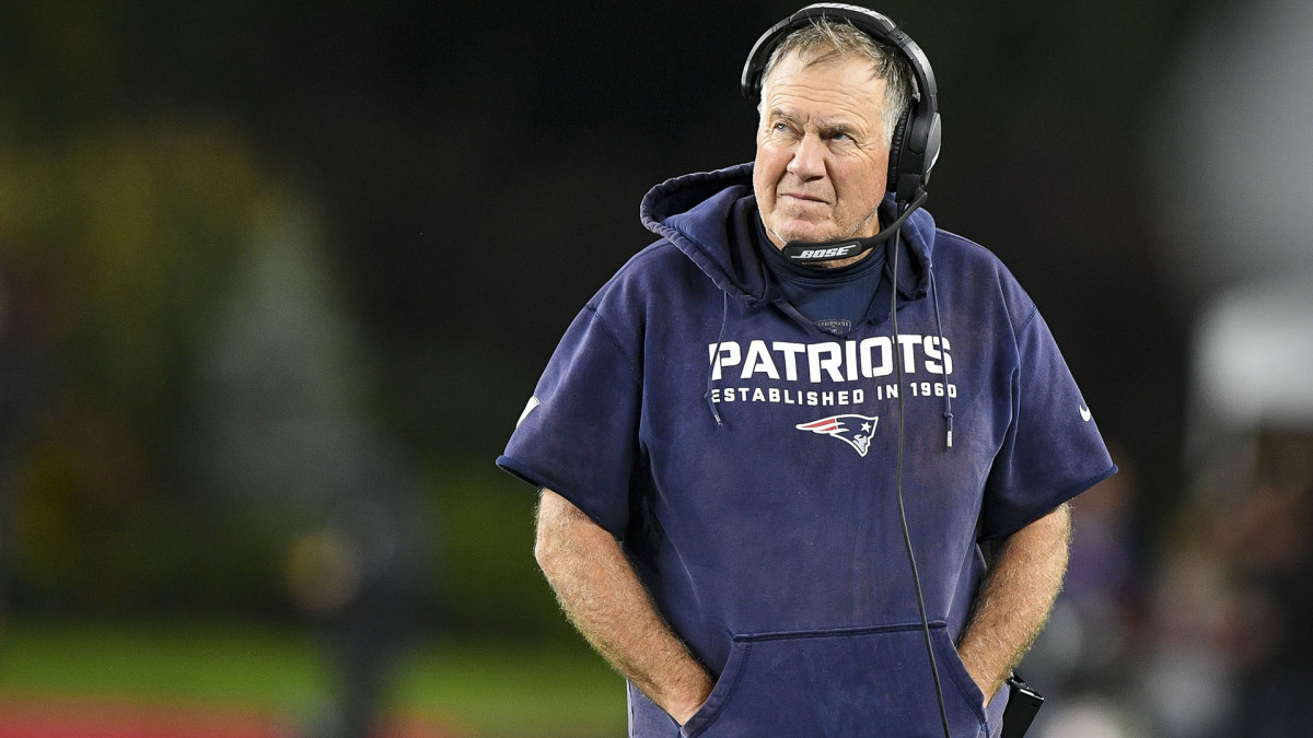 Bill Belichick looks at the scoreboard during a loss to Tom Brady and the Bucs