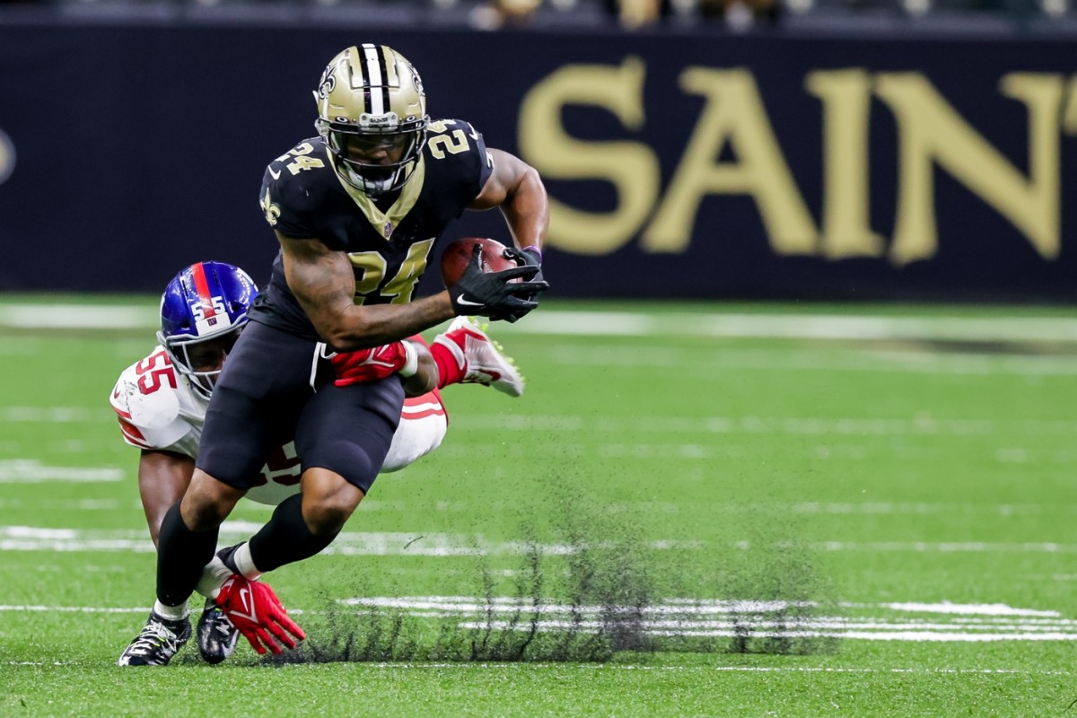 Oct 3, 2021; New Orleans, Louisiana, USA; New York Giants inside linebacker Reggie Ragland (55) misses the tackle on New Orleans Saints running back Dwayne Washington (24) during the first half at Caesars Superdome. Mandatory Credit: Stephen Lew-USA TODAY Sports