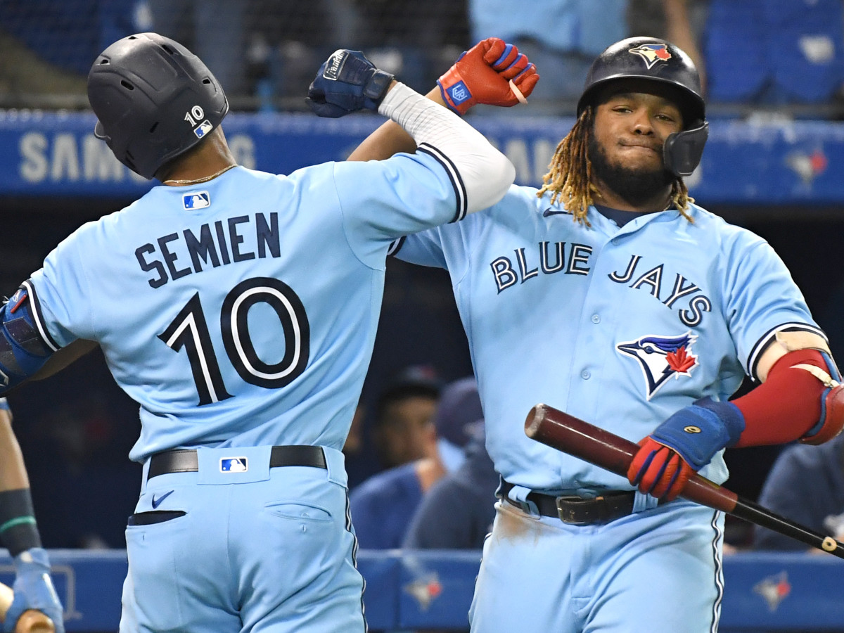 Toronto Blue Jays second baseman Marcus Semien (10) is greeted by first baseman Vladimir Guererro Jr. (27) after hitting a solo home run against Baltimore Orioles in the fifth inning at Rogers Centre.