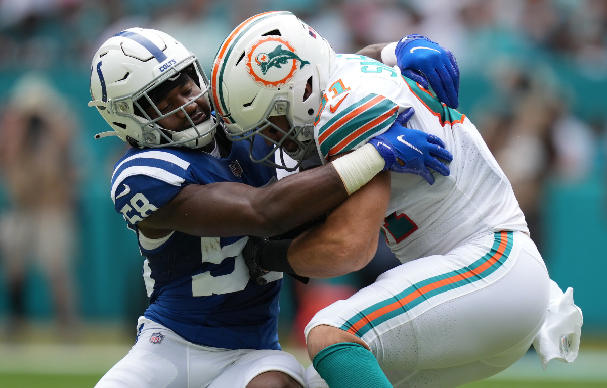 Oct 3, 2021; Miami Gardens, Florida, USA; Indianapolis Colts inside linebacker Bobby Okereke (58) tackles Miami Dolphins tight end Durham Smythe (81) during the first half at Hard Rock Stadium.