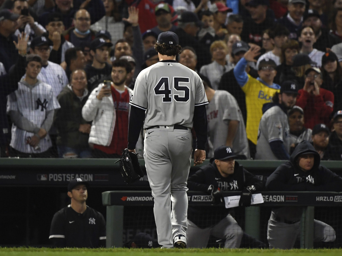 New York Yankees starting pitcher Gerrit Cole (45) walks to the dugout after being pulled against the Boston Red Sox during the third inning of the American League Wildcard game at Fenway Park.