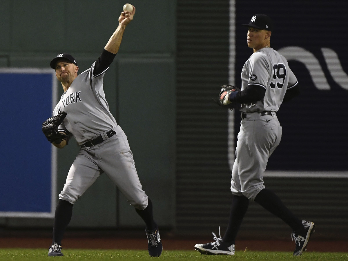 New York Yankees center fielder Brett Gardner (11) throws after playing for the single hit by Boston Red Sox right fielder Hunter Renfroe (10) during the fourth inning of AL wild-card game.