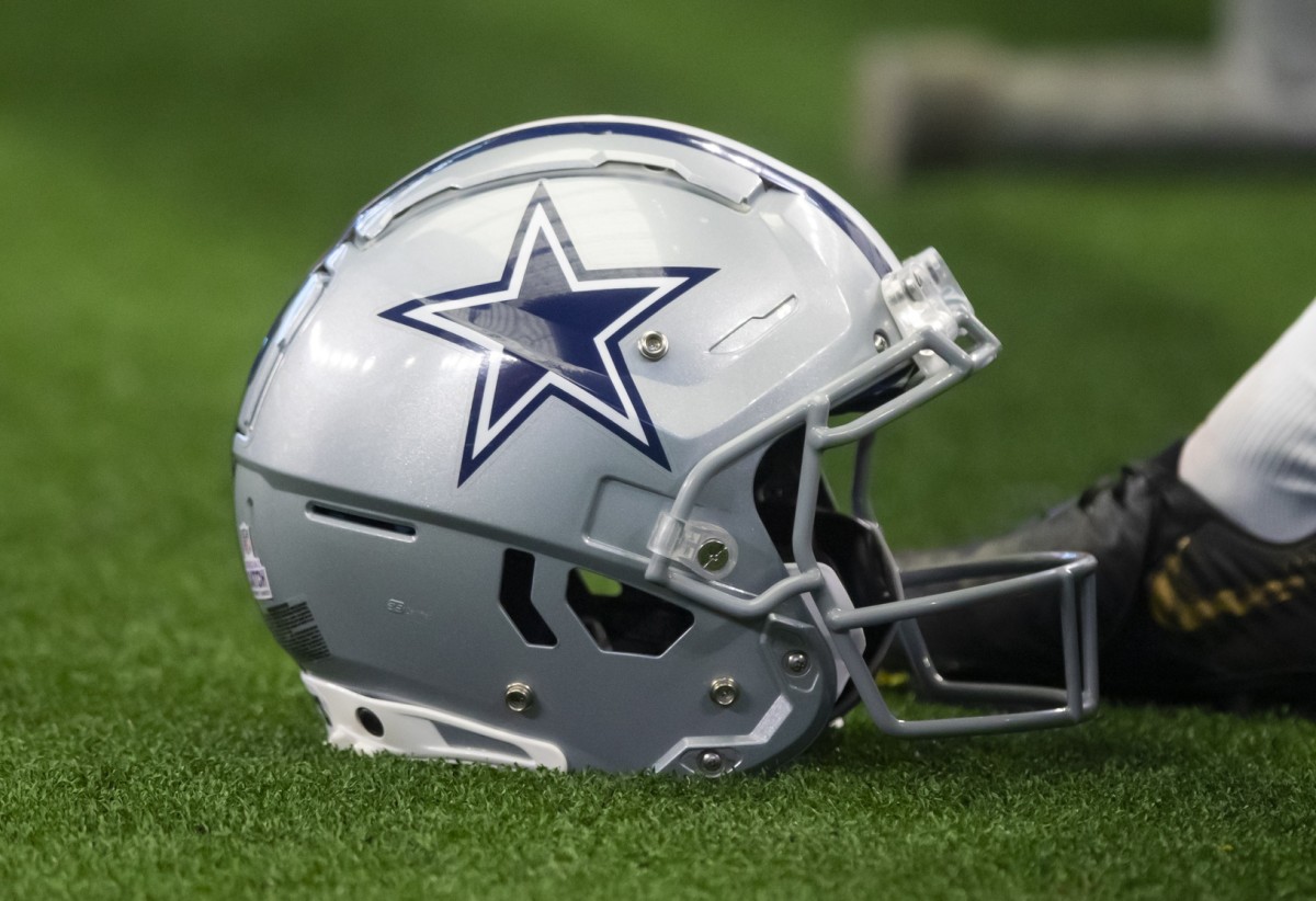 Oct 3, 2021; Arlington, Texas, USA; Detailed view of a Dallas Cowboys football helmet against the Carolina Panthers at AT&T Stadium.