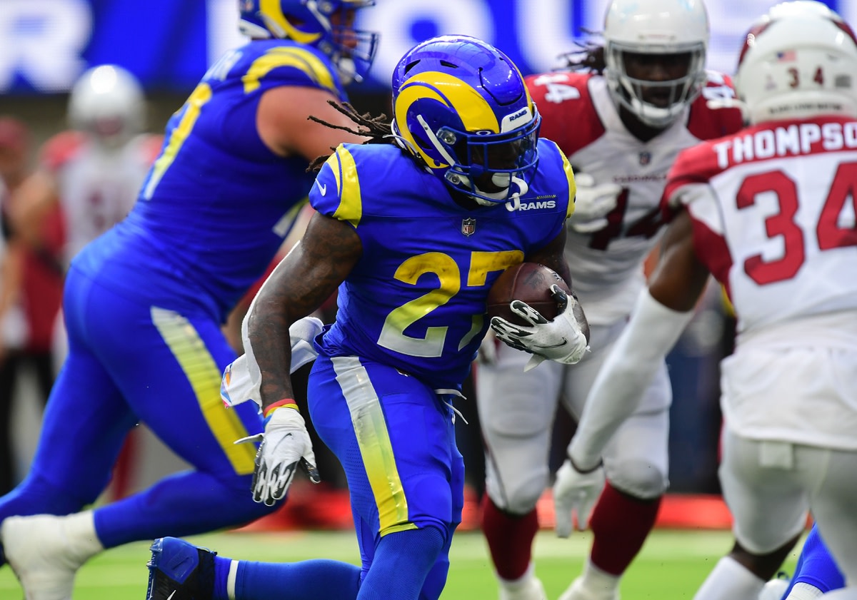 Oct 3, 2021; Inglewood, California, USA; Los Angeles Rams running back Darrell Henderson (27) runs the ball against the Arizona Cardinals during the first half at SoFi Stadium. Mandatory Credit: Gary A. Vasquez-USA TODAY Sports