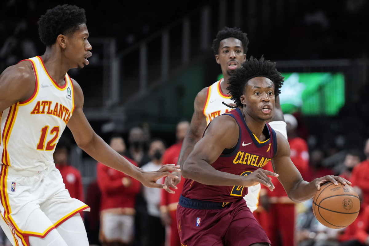 Cleveland Cavaliers guard Collin Sexton (2) dribbles past Atlanta Hawks forward De'Andre Hunter (12) during the first quarter at State Farm Arena.