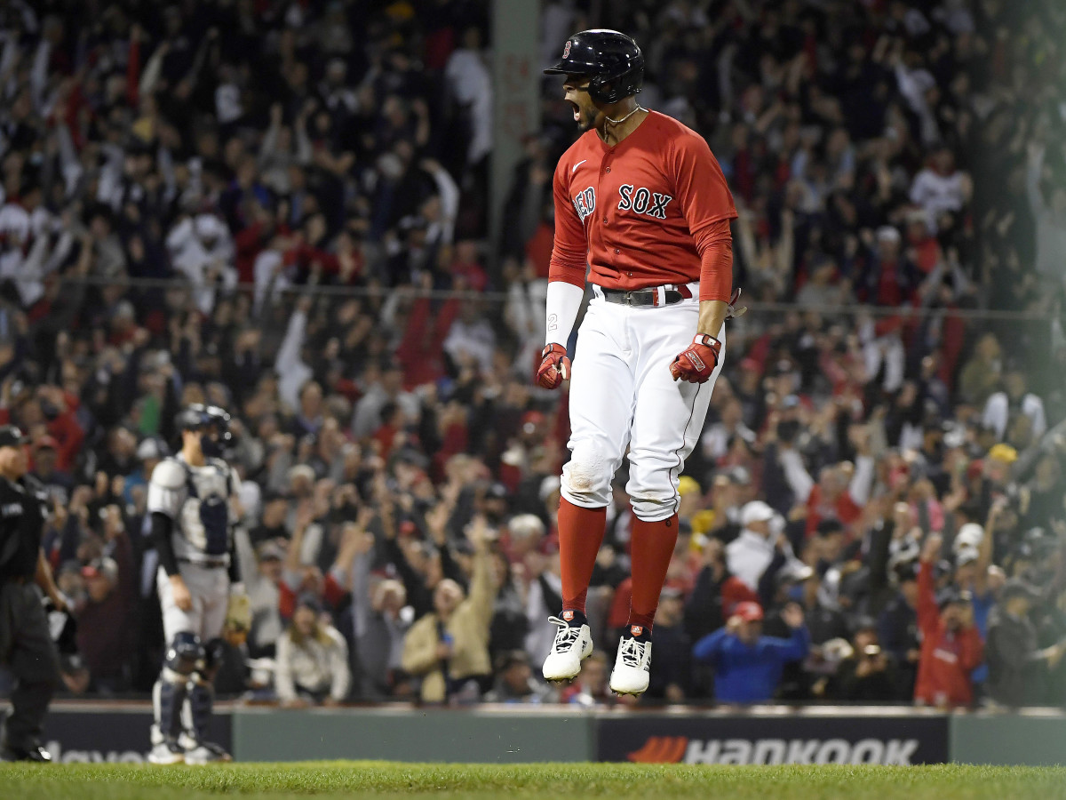 Oct 5, 2021; Boston, Massachusetts, USA; Boston Red Sox shortstop Xander Bogaerts (2) reacts after hitting a two run home run against the New York Yankees during the first inning of the American League Wildcard game at Fenway Park.