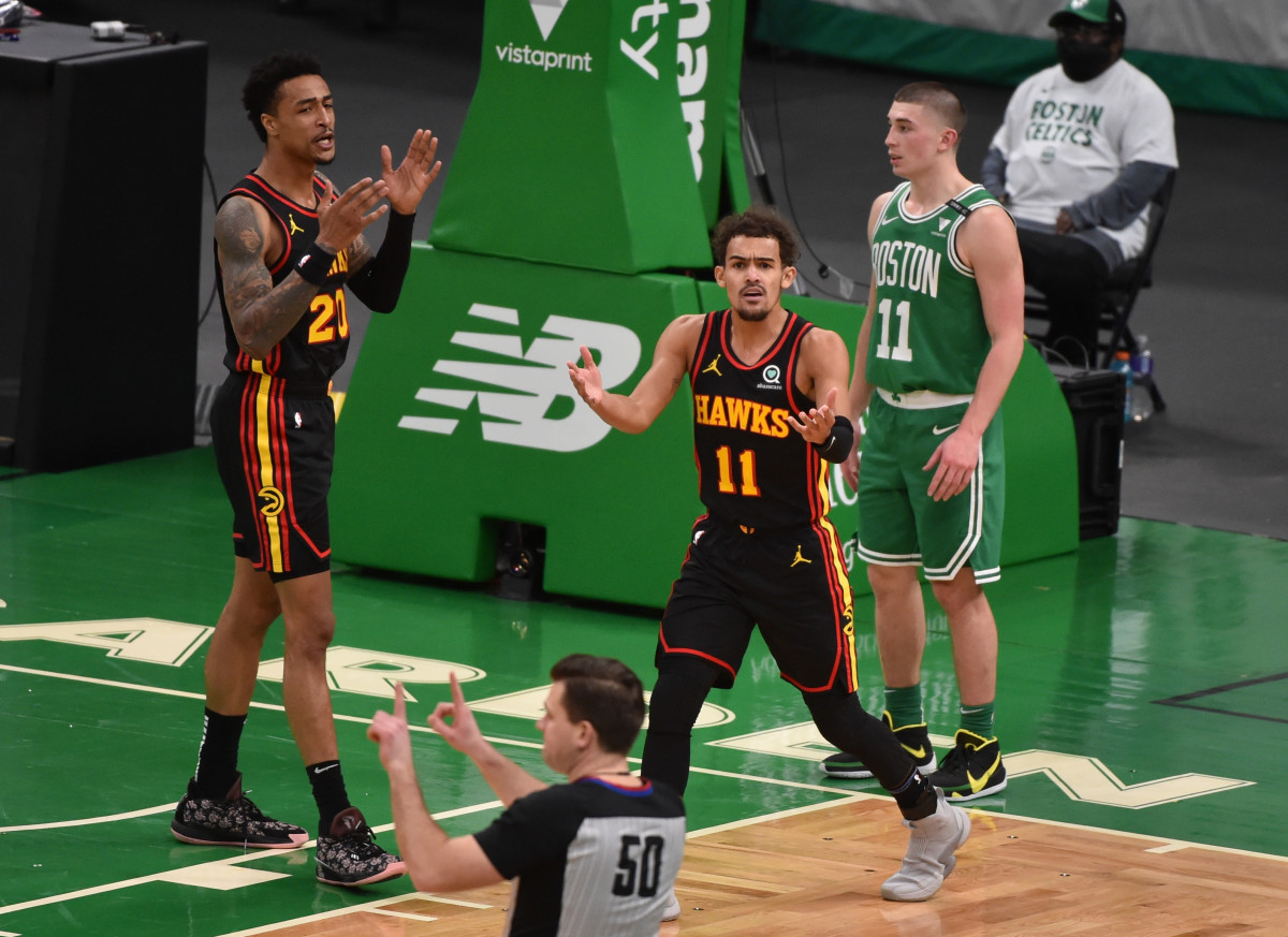 Atlanta Hawks guard Trae Young (11) reacts after a call during the first half against the Boston Celtics at TD Garden.