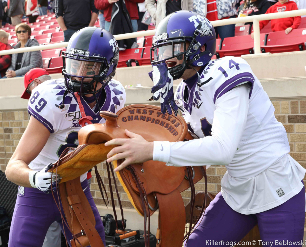 TCU Horned Frogs celebrate winning the West Texas Championship saddle in 2019.