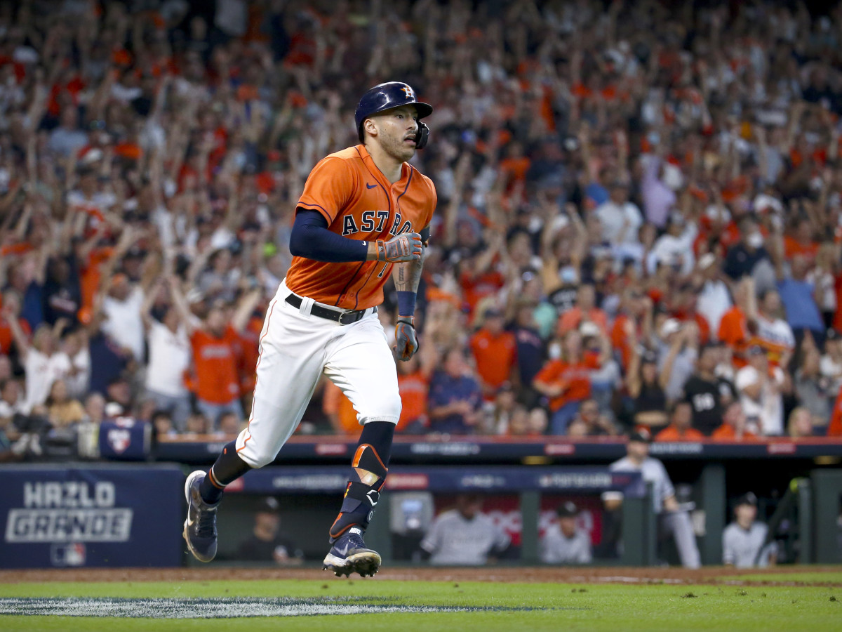 Oct 8, 2021; Houston, Texas, USA; Houston Astros shortstop Carlos Correa (1) hits a double and drives in a run against the Chicago White Sox during the seventh inning in game two of the 2021 ALDS at Minute Maid Park.