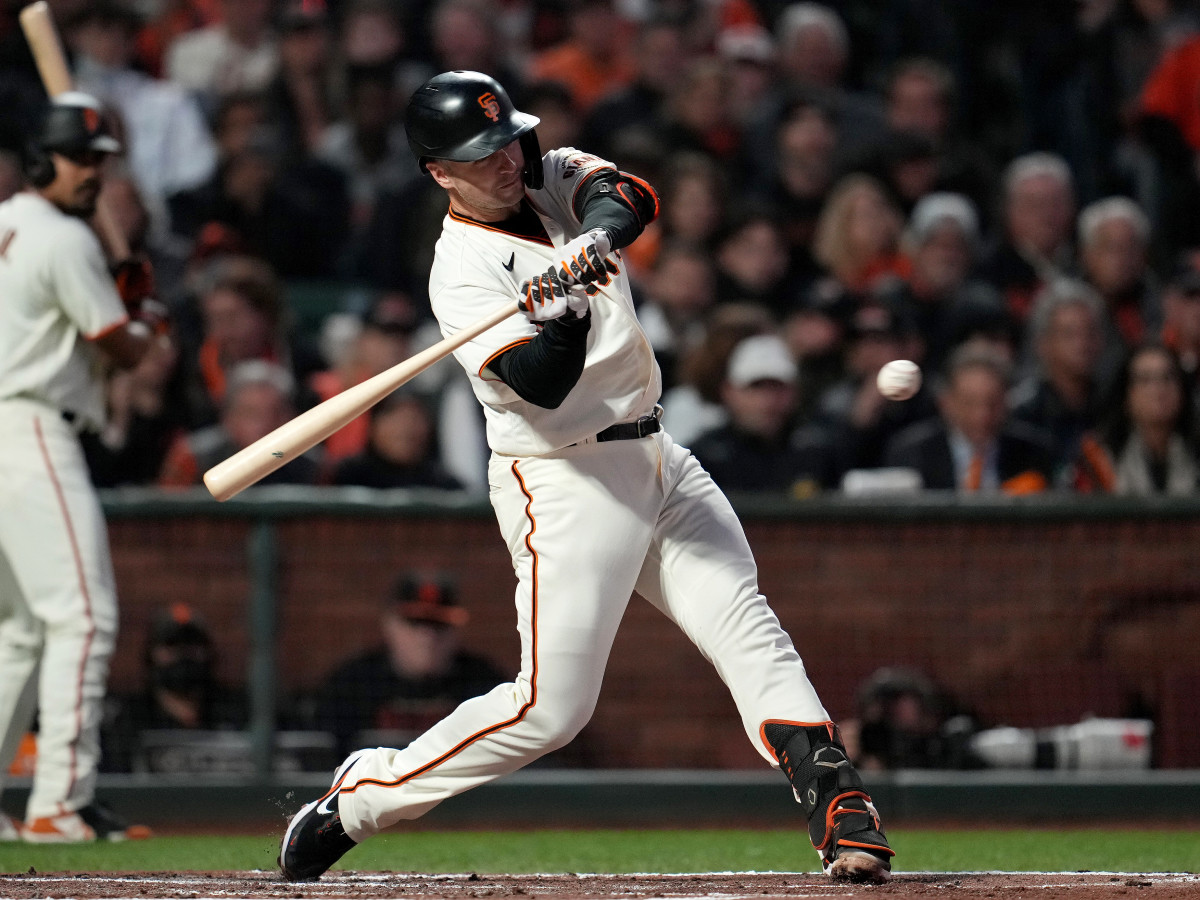 Oct 8, 2021; San Francisco, California, USA; San Francisco Giants catcher Buster Posey (28) hits a two run home run in the first inning against the Los Angeles Dodgers during game one of the 2021 NLDS at Oracle Park.