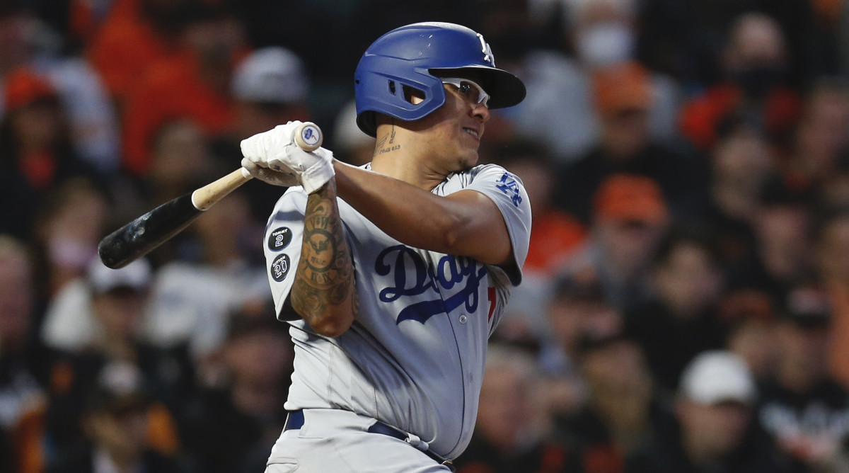 Los Angeles Dodgers starting pitcher Julio Urias (7) follows through on a RBI single against the San Francisco Giants in the second inning during game two of the 2021 NLDS at Oracle Park.