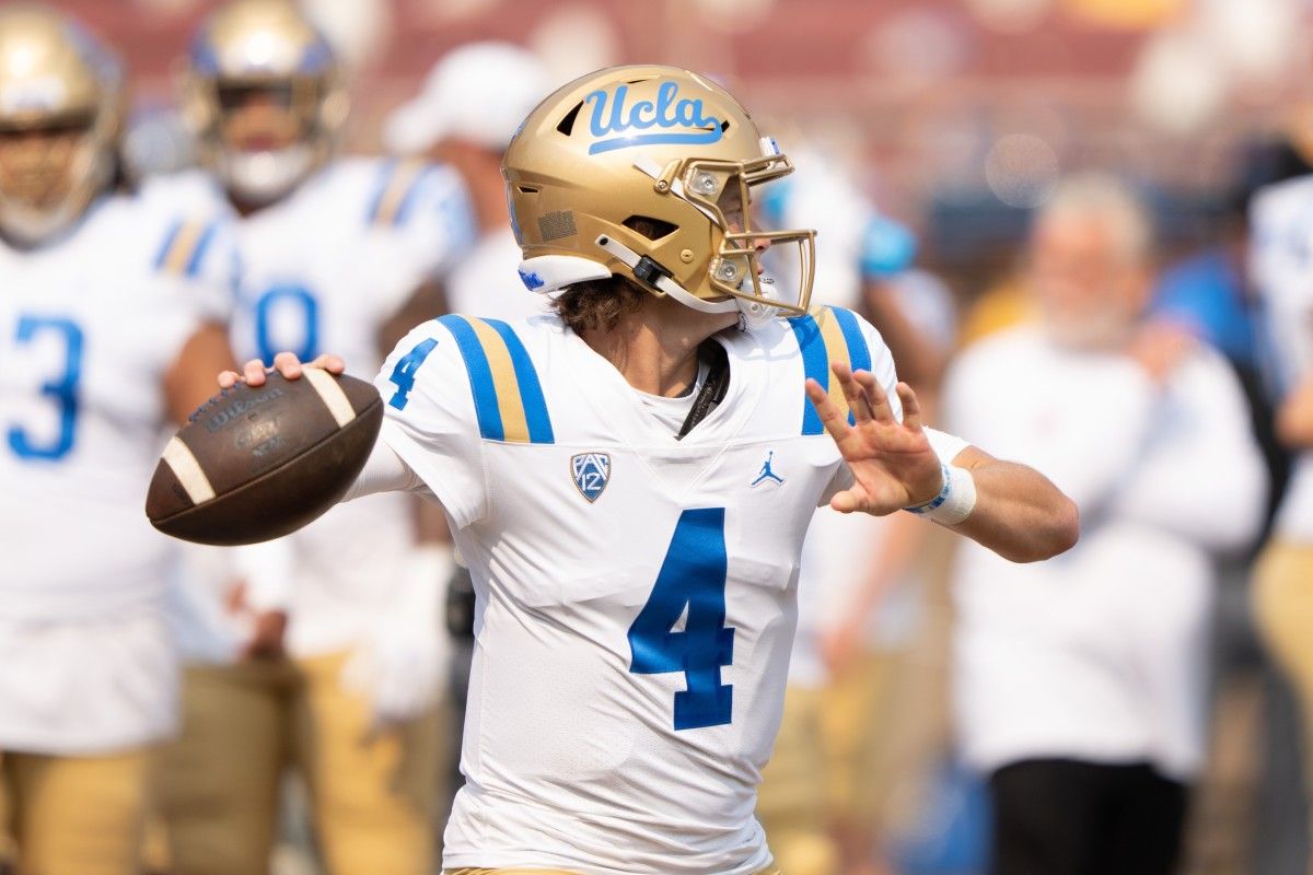 Ex-Husky QB Ethan Garbers mostly holds on kicks for UCLA.