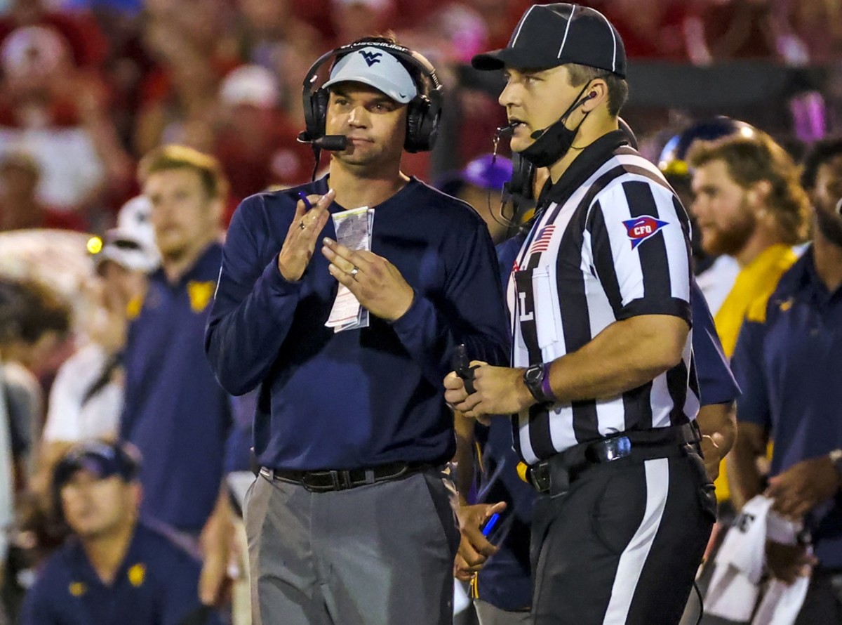 Sep 25, 2021; Norman, Oklahoma, USA; West Virginia Mountaineers head coach Neal Brown calls a timeout during the second quarter against the Oklahoma Sooners at Gaylord Family-Oklahoma Memorial Stadium.