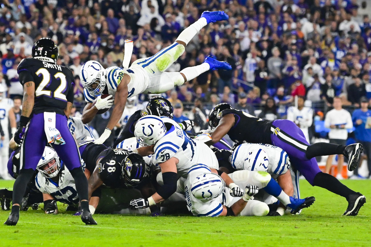 Oct 11, 2021; Baltimore, Maryland, USA; Indianapolis Colts running back Jonathan Taylor (28) dives over the pile for a first down during the fourth quarter against the Baltimore Ravens at M&T Bank Stadium.