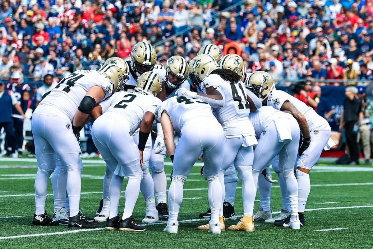 New Orleans Saints offense huddles against New England Patriots. Mandatory Credit: Stephen Lew-USA TODAY