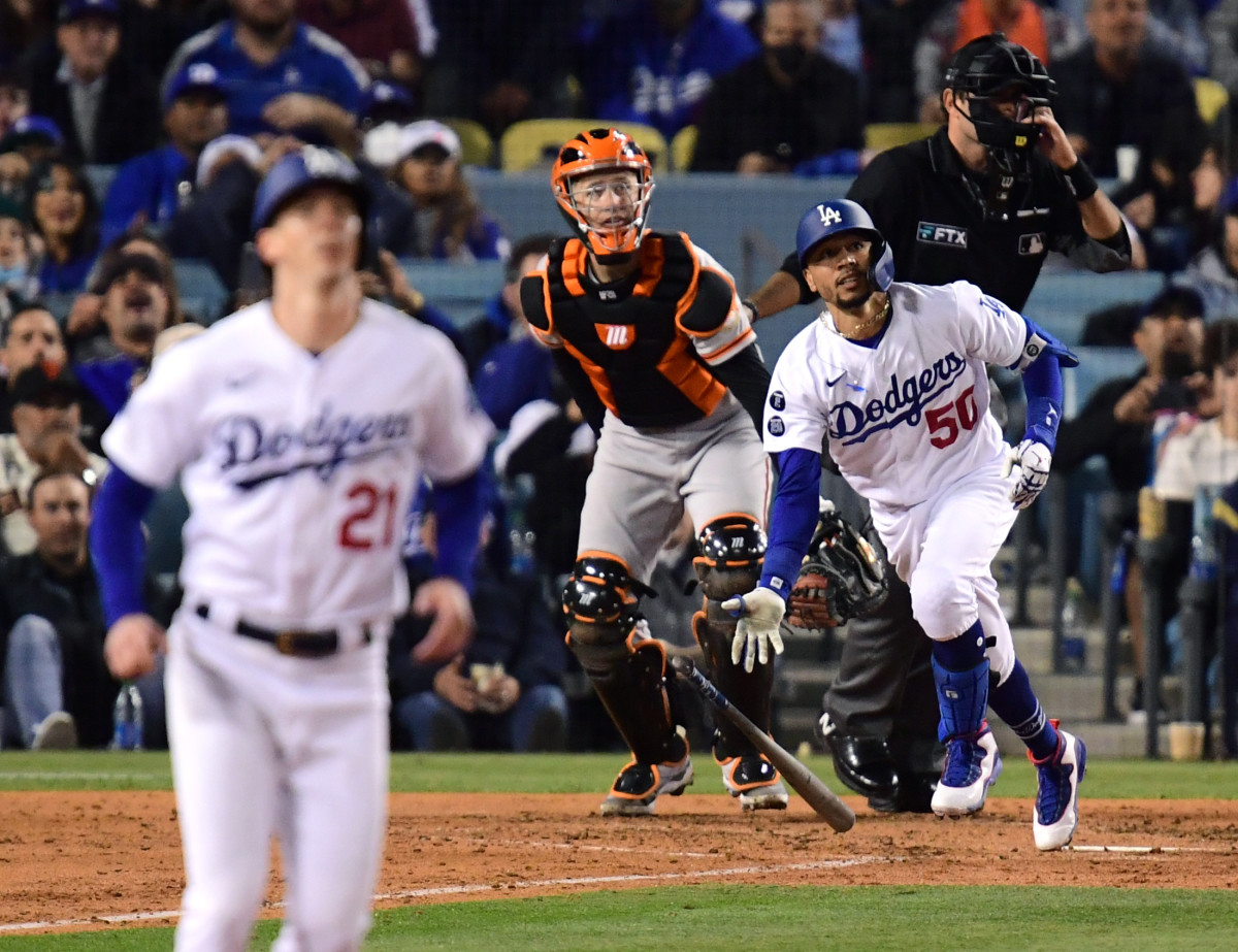 Los Angeles Dodgers right fielder Mookie Betts (50) hits a two-run home run during the fourth inning against the San Francisco Giants in game four of the 2021 NLDS at Dodger Stadium.