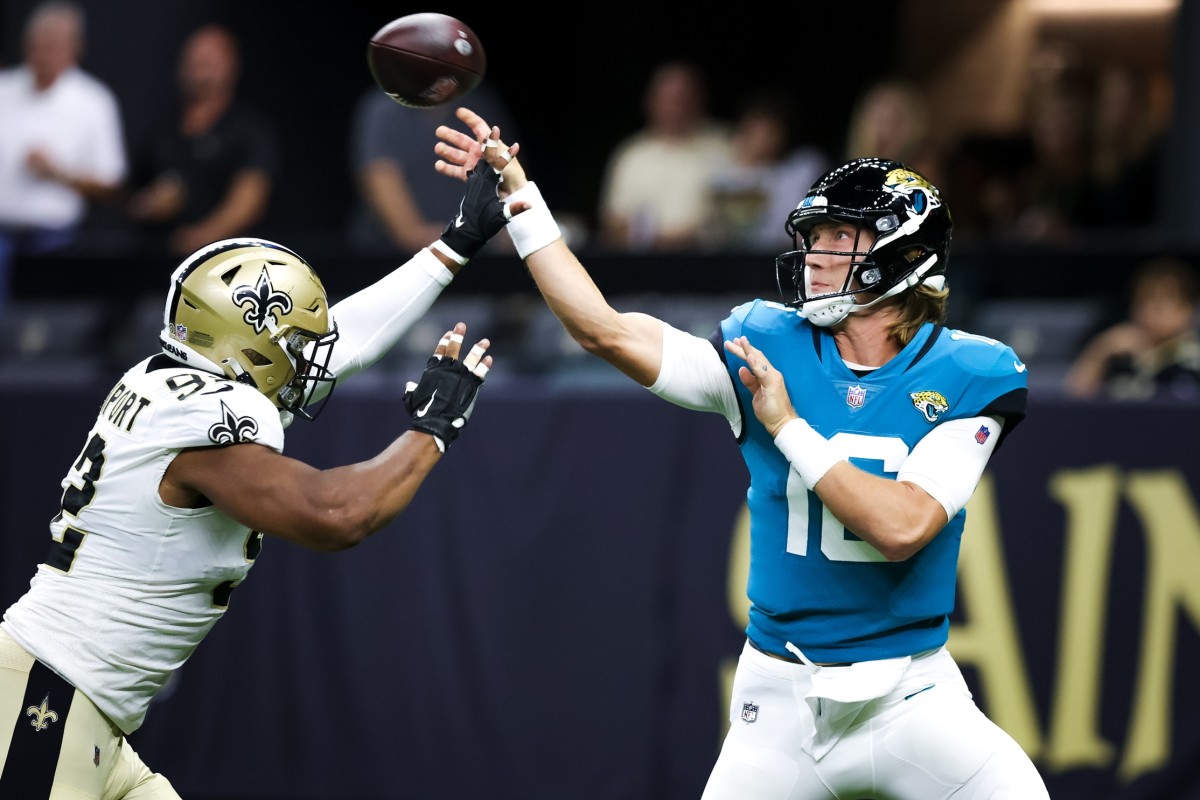 Jacksonville quarterback Trevor Lawrence (16) throws an incomplete pass under pressure from New Orleans defensive end Marcus Davenport (92). Mandatory Credit: Stephen Lew-USA TODAY Sports