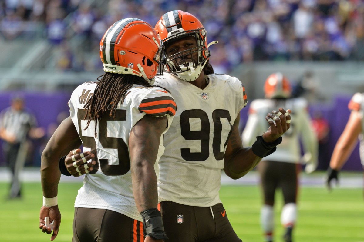 Oct 3, 2021; Minneapolis, Minnesota, USA; Cleveland Browns defensive end Jadeveon Clowney (90) and defensive end Takkarist McKinley (55) react during the fourth quarter against the Minnesota Vikings at U.S. Bank Stadium. Mandatory Credit: Jeffrey Becker-USA TODAY Sports