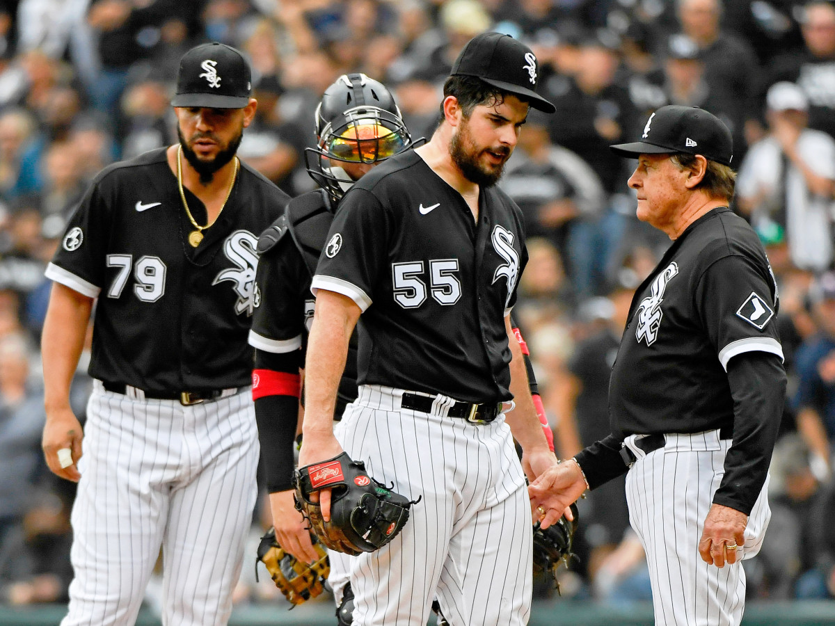 Oct 12, 2021; Chicago, Illinois, USA; Chicago White Sox starting pitcher Carlos Rodon (55) is taken out of the game against the Houston Astros by manager Tony La Russa (22) during the third inning in game four of the 2021 ALDS at Guaranteed Rate Field.