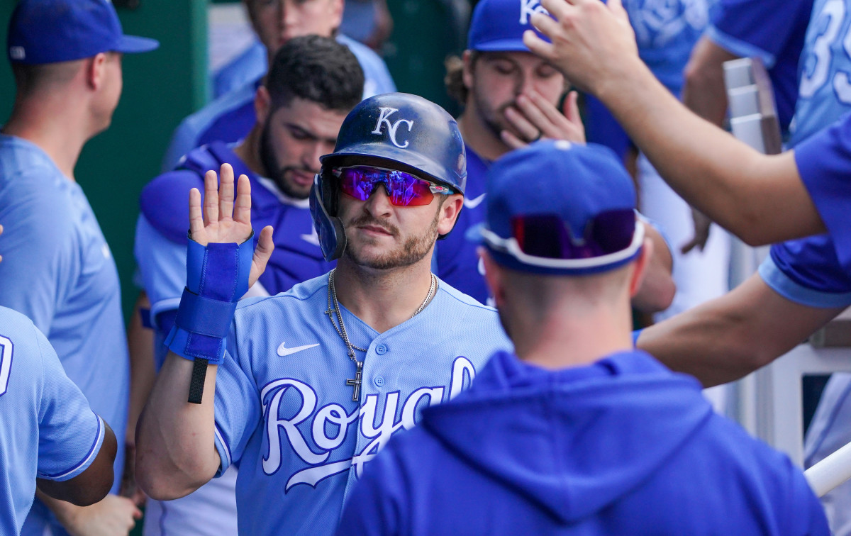 Oct 3, 2021; Kansas City, Missouri, USA; Kansas City Royals center fielder Kyle Isbel (28) is congratulated in the dugout after scoring against the Minnesota Twins in the third inning at Kauffman Stadium. Mandatory Credit: Denny Medley-USA TODAY Sports