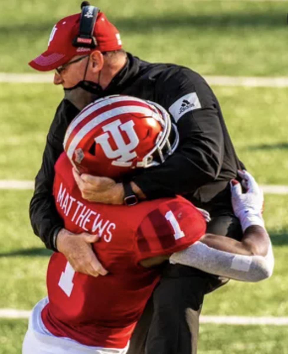 After an interception against Michigan in 2020, Indiana safety Devon Matthews jumped into the arms of Tom Allen, his cut his coach's face with his helmet. (USA TODAY Sports)