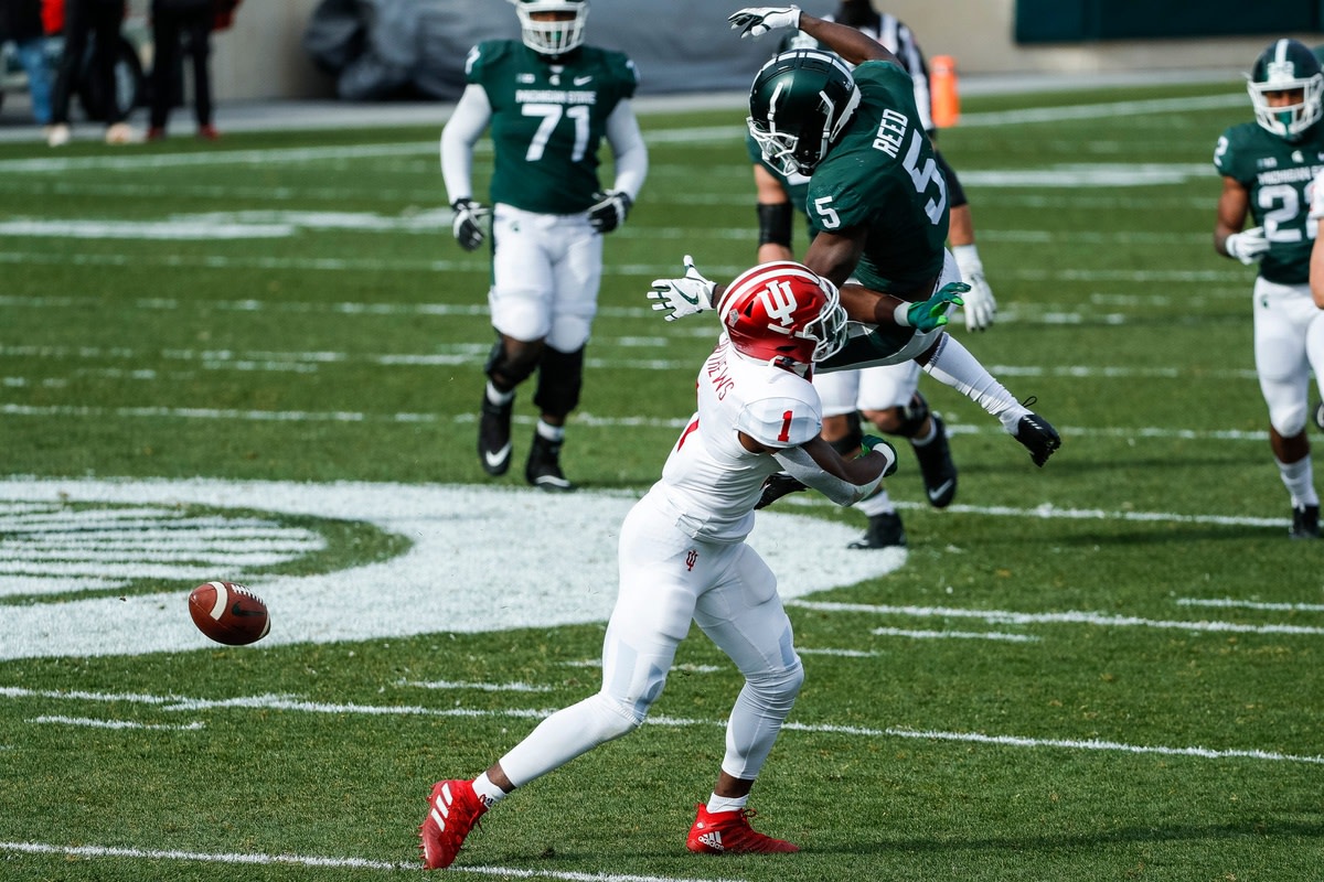 Michigan State wide receiver Jayden Reed is defended by Indiana defensive back Devon Matthews during the Hoosiers' 24-0 victory in November of 2020. (USA TODAY Sports).