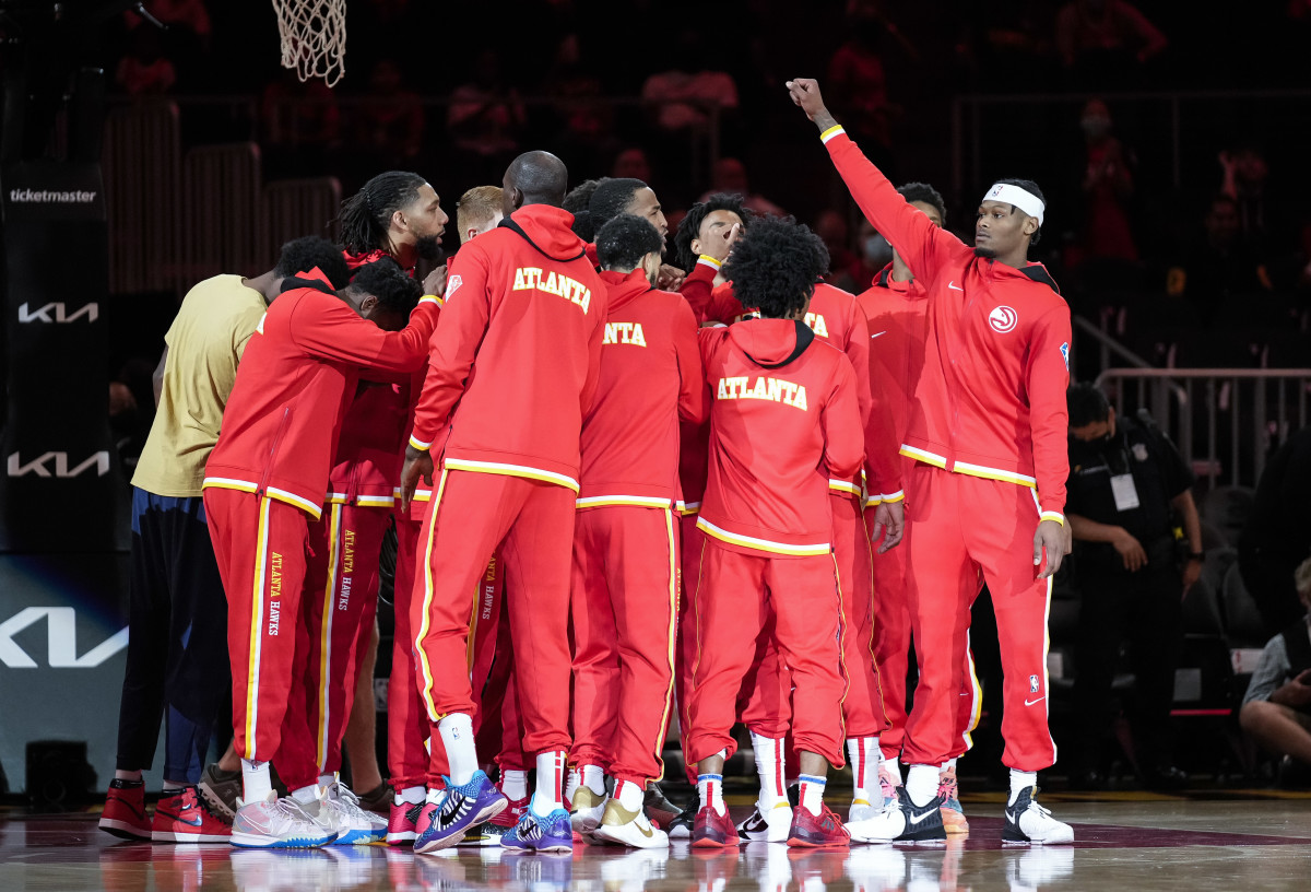 Atlanta Hawks players huddle before playing the Cleveland Cavaliers at State Farm Arena.