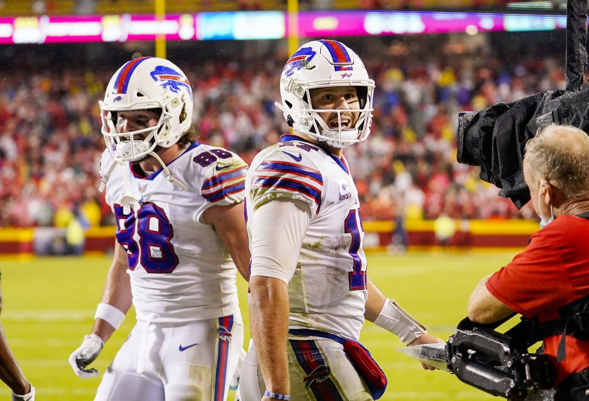 Oct 10, 2021; Kansas City, Missouri, USA; Buffalo Bills quarterback Josh Allen (17) and tight end Dawson Knox (88) celebrate after a touchdown against the Kansas City Chiefs during the second half at GEHA Field at Arrowhead Stadium. Mandatory Credit: Jay Biggerstaff-USA TODAY Sports