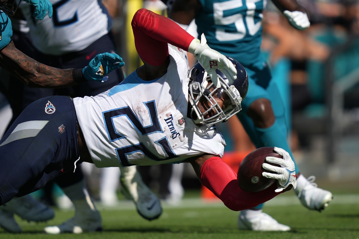 Oct 10, 2021; Jacksonville, Florida, USA; Tennessee Titans running back Derrick Henry (22) dives for the end zone during the second half against the Jacksonville Jaguars at TIAA Bank Field. Mandatory Credit: Jasen Vinlove-USA TODAY Sports