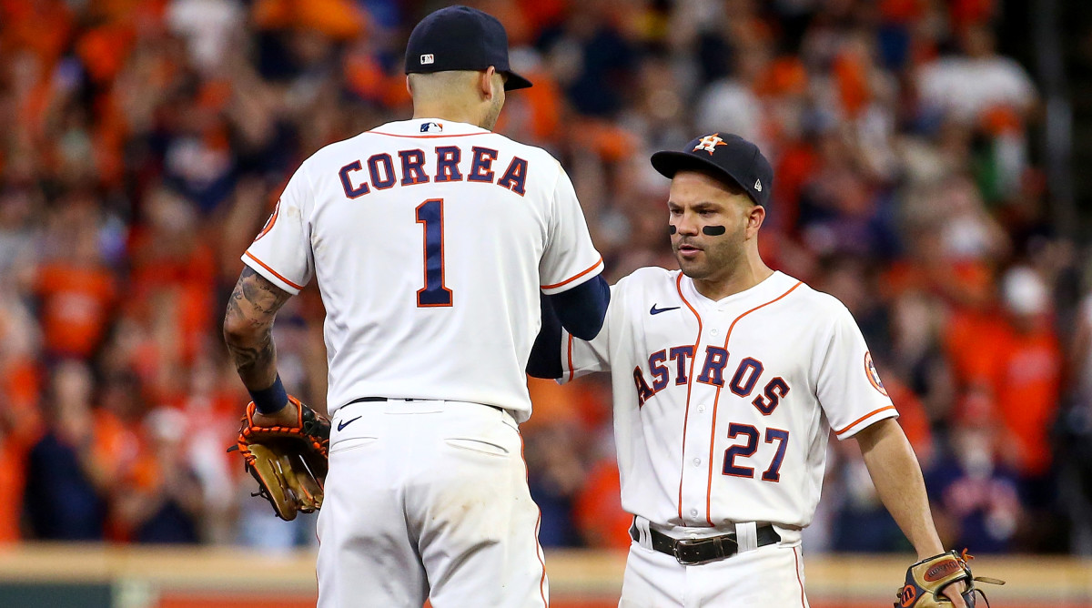 Oct 15, 2021; Houston, Texas, USA; Houston Astros second baseman Jose Altuve (27) and shortstop Carlos Correa (1) celebrate after the Astros defeated the Boston Red Sox in game one of the 2021 ALCS at Minute Maid Park.