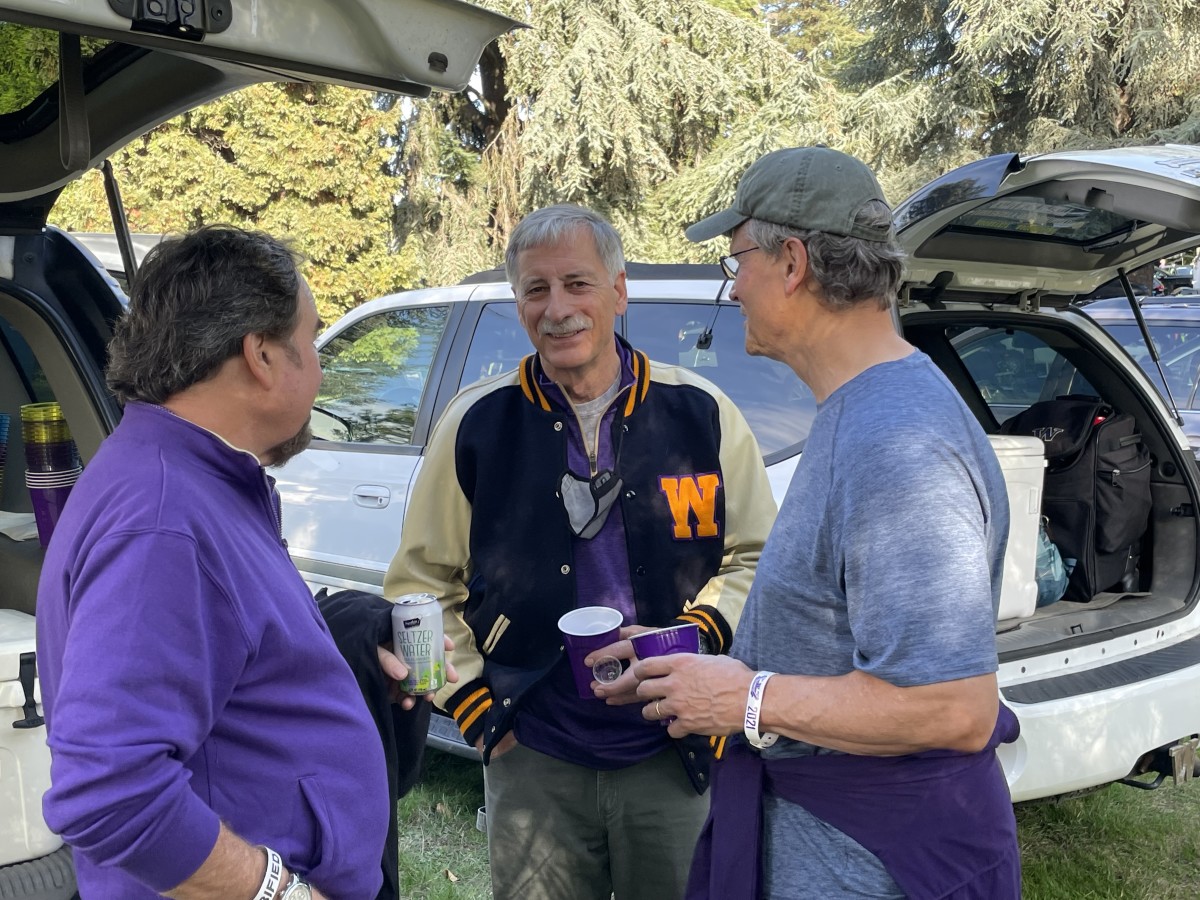 Richard Karn shares a moment with friends before kickoff.