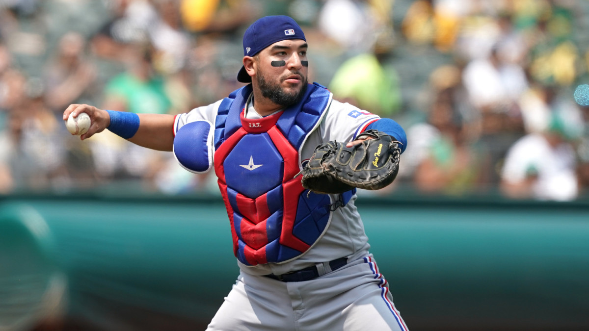 Aug 7, 2021; Oakland, California, USA; Texas Rangers catcher Jose Trevino (23) throws the ball to first base during the second inning against the Oakland Athletics at RingCentral Coliseum. Mandatory Credit: Darren Yamashita-USA TODAY Sports