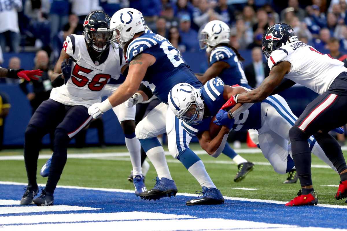 Indianapolis Colts running back Jonathan Taylor (28) punches past Houston Texans safety Lonnie Johnson (1) for a touchdown Sunday, Oct. 17, 2021, during a game against the Houston Texans at Lucas Oil Stadium in Indianapolis.