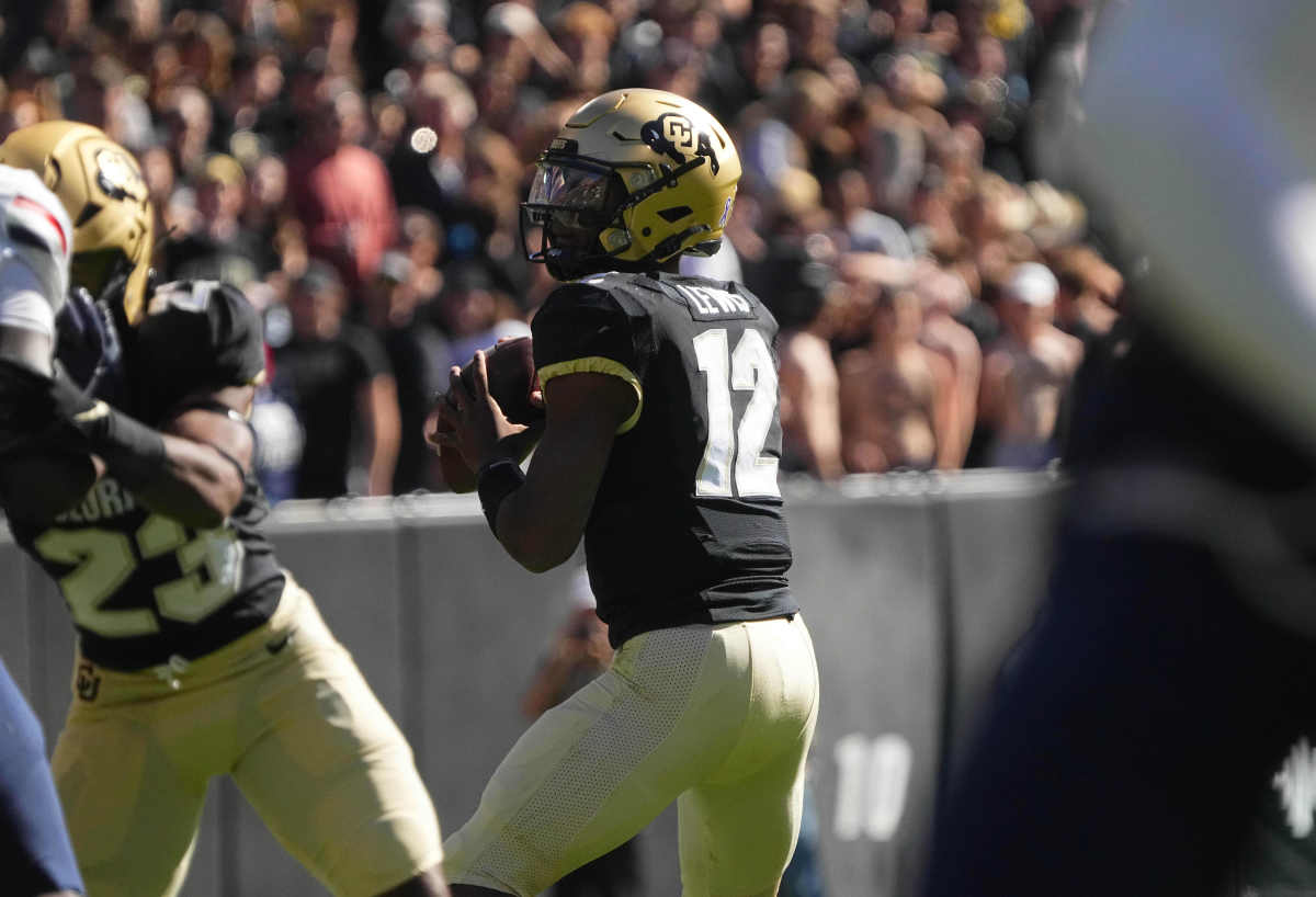 Colorado Buffaloes quarterback Brendon Lewis (12) loads up to pass the ball.