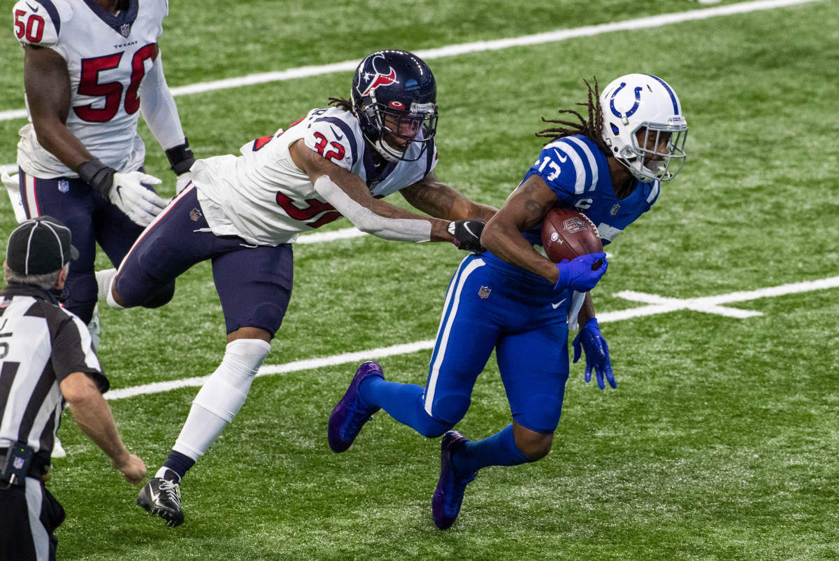 Dec 20, 2020; Indianapolis, Indiana, USA; Indianapolis Colts wide receiver T.Y. Hilton (13) runs the ball against Houston Texans cornerback Lonnie Johnson (32) in the second half at Lucas Oil Stadium.