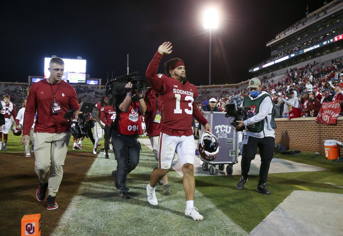 Oct 16, 2021; Norman, Oklahoma, USA; Oklahoma Sooners quarterback Caleb Williams (13) waves to fans after the game against the TCU Horned Frogs at Gaylord Family-Oklahoma Memorial Stadium.