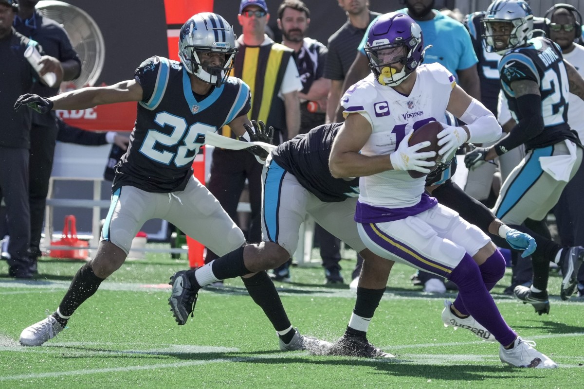 Keith Taylor moves in to tackle Minnesota receiver Adam Thielen.