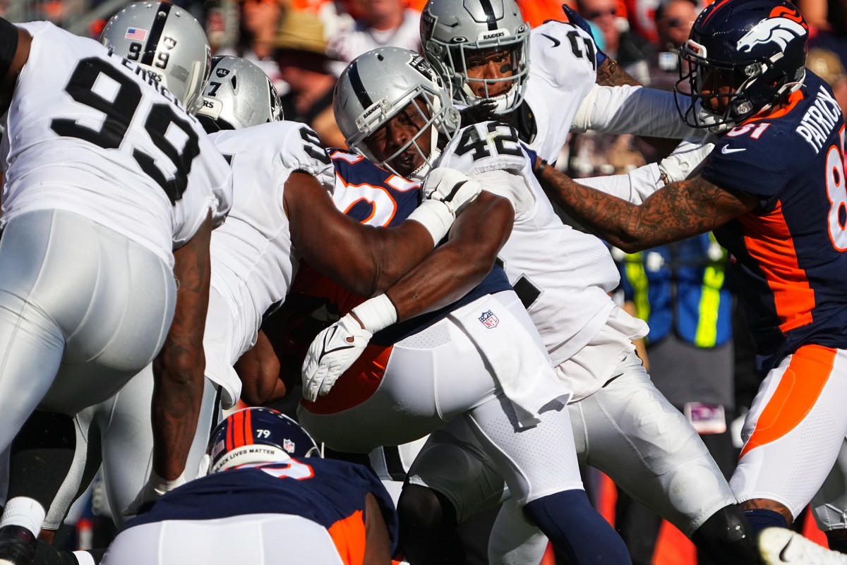 Cory Littleton brings down Denver's Javonte Williams, one of his 11 tackles for the Raiders.