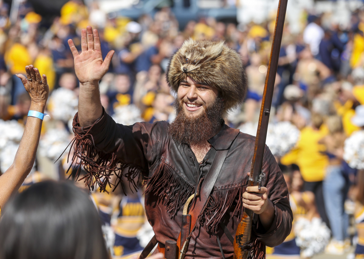 Oct 2, 2021; Morgantown, West Virginia, USA; The West Virginia Mountaineers mascot leads the team into the stadium prior to their game against the Texas Tech Red Raiders at Mountaineer Field at Milan Puskar Stadium. Mandatory Credit: Ben Queen-USA TODAY Sports