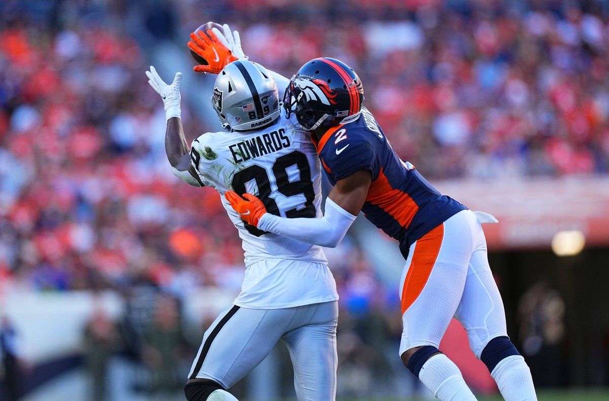 Denver Broncos cornerback Pat Surtain II (2) breaks up a pass to Las Vegas Raiders wide receiver Bryan Edwards (89) in the second half at Empower Field at Mile High.