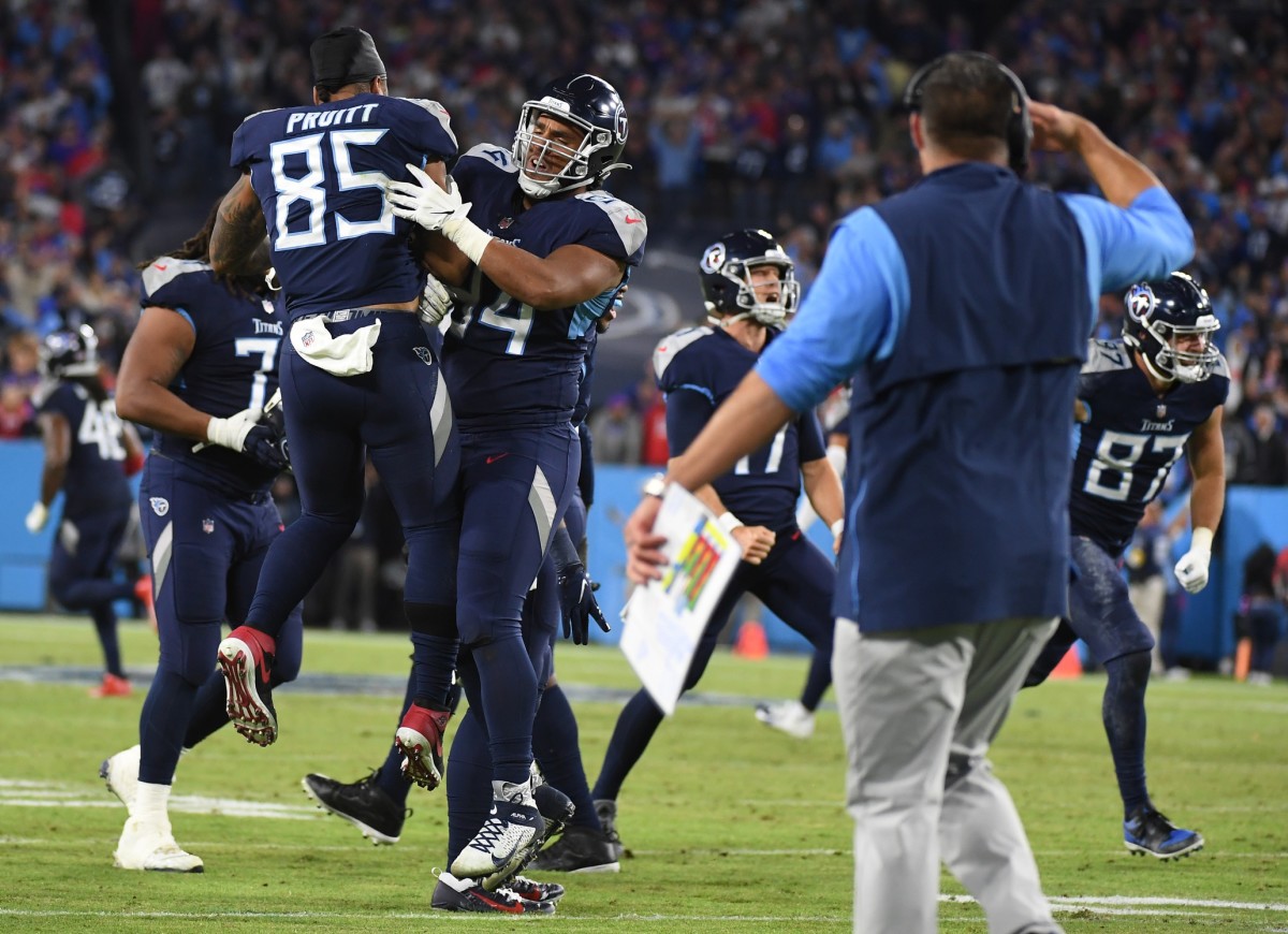 Tennessee Titans players celebrate after a defensive stop on fourth down late in the fourth quarter against the Buffalo Bills at Nissan Stadium.
