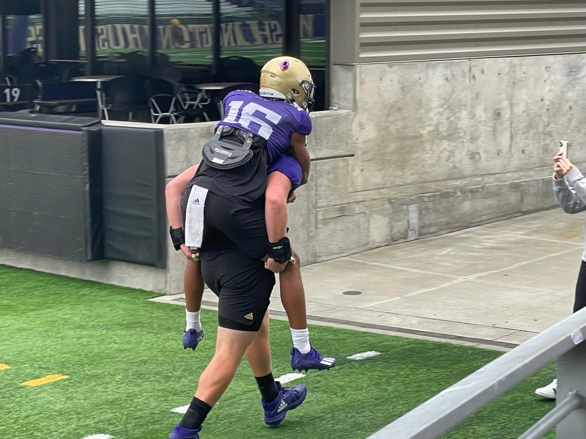 Rome Odunze gets a piggyback ride to practice from Geirean Hatchett.
