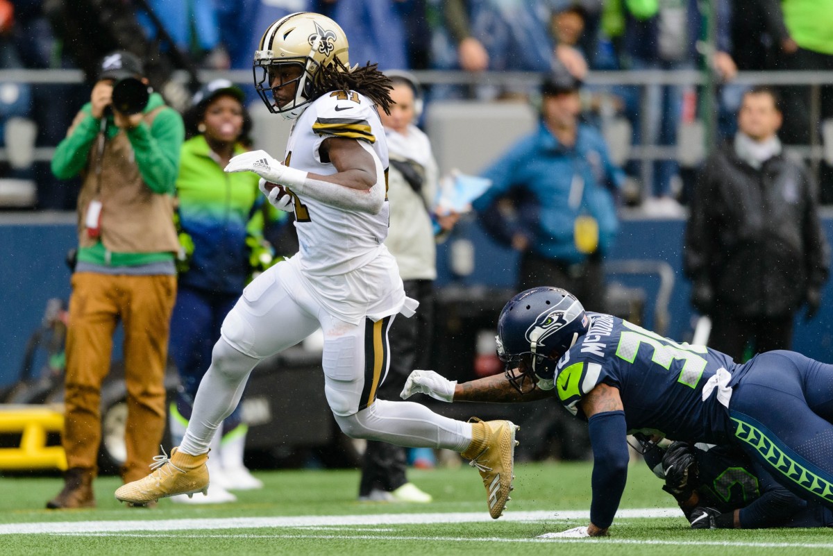 New Orleans Saints running back Alvin Kamara (41) runs the ball in for a touchdown against the Seattle Seahawks. Mandatory Credit: Steven Bisig-USA TODAY Sports