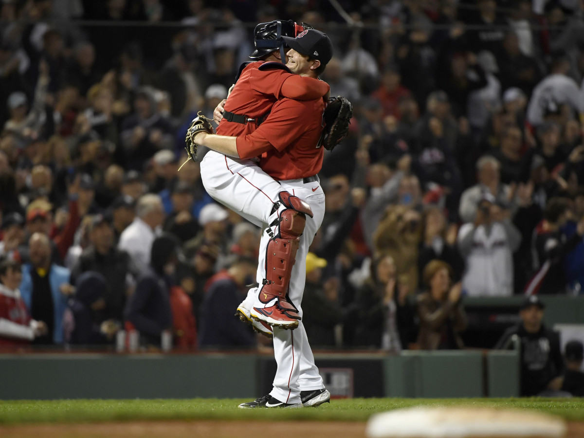 Oct 5, 2021; Boston, Massachusetts, USA; Boston Red Sox catcher Christian Vazquez (7) and relief pitcher Garrett Whitlock (72) celebrate the 6-2 victory against the New York Yankees in the American League Wildcard game at Fenway Park.