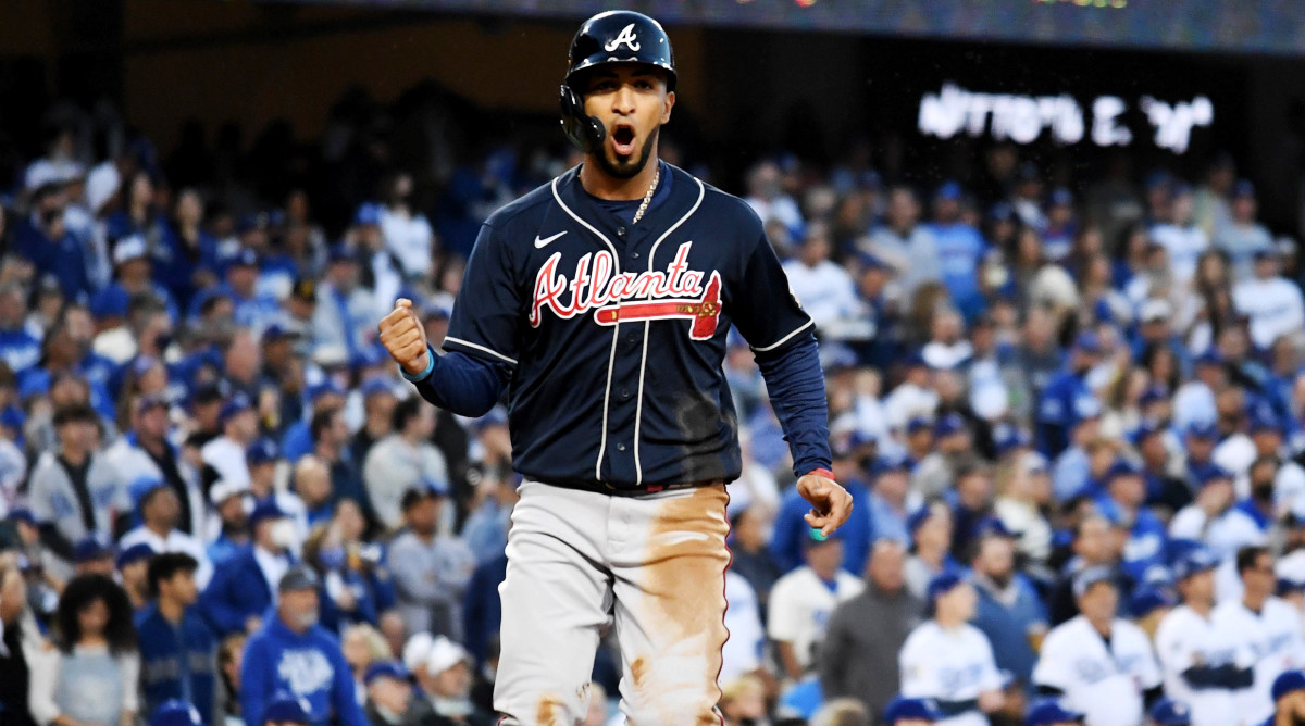 Oct 20, 2021; Los Angeles, California, USA; Atlanta Braves left fielder Eddie Rosario (8) celebrates scoring in the third inning a during game four of the 2021 NLCS at Dodger Stadium.