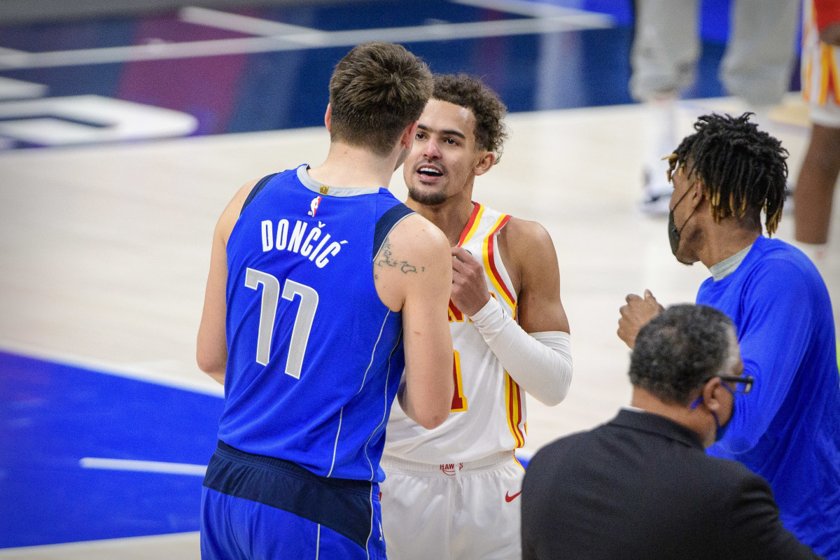 Dallas Mavericks guard Luka Doncic (77) talks with Atlanta Hawks guard Trae Young (11) after the game at the American Airlines Center.